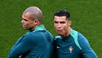 Portugal's forward #07 Cristiano Ronaldo and Portugal's defender #03 Pepe (L) warm up prior to the UEFA Euro 2024 Group F football match between Portugal and the Czech Republic at the Leipzig Stadium in Leipzig on June 18, 2024. (Photo by GABRIEL BOUYS / AFP)