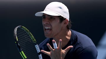Tennis - Australian Open - Melbourne Park, Melbourne, Australia - January 20, 2026 Chile's Cristian Garin reacts during his first round match against Italy's Luciano Darderi REUTERS/Edgar Su