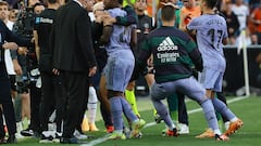 Real Madrid's Brazilian forward Vinicius Junior (C) leaves after being sent off the pitch by the referee during the Spanish league football match between Valencia CF and Real Madrid CF at the Mestalla stadium in Valencia on May 21, 2023. (Photo by JOSE JORDAN / AFP)