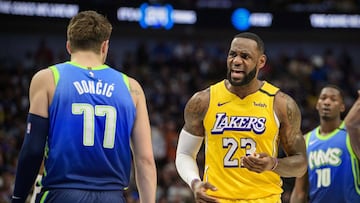 Jan 10, 2020; Dallas, Texas, USA; Los Angeles Lakers forward LeBron James (23) argues a call in front of Dallas Mavericks forward Luka Doncic (77) during the second quarter at the American Airlines Center. Mandatory Credit: Jerome Miron-USA TODAY Sports