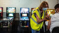 LOUISVILLE, KY - JUNE 04: Alan Drees receives their Moderna COVID-19 vaccine during a mobile vaccination mission in the arcade area at Mile Wide Beer Co. on June 4, 2021 in Louisville, Kentucky. The vaccination event was facilitated in partnership with th