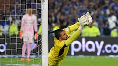 Millonarios' goalkeeper Alvaro Montero stops a penalty kick during the Colombian First Division Football Championship final match between Millonarios and Atletico Nacional at the El Campin stadium in Bogota on June 24, 2023. (Photo by Raul ARBOLEDA / AFP)