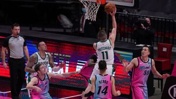 Jan 6, 2021; Miami, Florida, USA; Boston Celtics guard Payton Pritchard (11) shoots the game winning basket against the Miami Heat during the second half at American Airlines Arena. Mandatory Credit: Jasen Vinlove-USA TODAY Sports