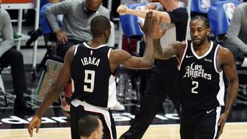 Los Angeles Clippers forward Kawhi Leonard (2) is high-fived by Serge Ibaka (9) after Leonard scored during the first half of the team&#039;s NBA basketball game against the Boston Celtics on Friday, Feb. 5, 2021, in Los Angeles. (AP Photo/Marcio Jose Sanchez)