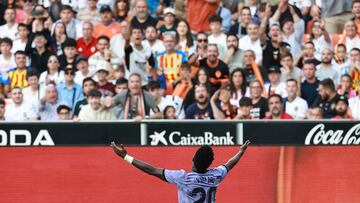 Real Madrid's Brazilian forward Vinicius Junior reacts during the Spanish league football match between Valencia CF and Real Madrid CF at the Mestalla stadium in Valencia on May 21, 2023. (Photo by JOSE JORDAN / AFP)