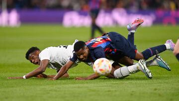 Real Madrid's French defender Aurelien Tchouameni (L) vies with Barcelona's Spanish forward Ansu Fati during the Copa del Rey (King's Cup) semi final first leg football match between Real Madrid CF and FC Barcelona at the Santiago Bernabeu stadium in Madrid on March 2, 2023. (Photo by OSCAR DEL POZO / AFP) (Photo by OSCAR DEL POZO/AFP via Getty Images)