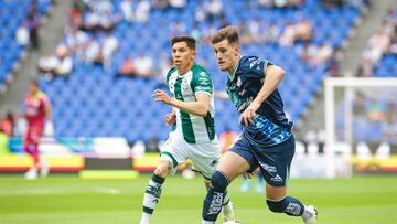 Aldo Lopez (L) of Santos fights for the ball with Facundo Waller (R) of Puebla during the 1st round match between Puebla and Santos as part of the Torneo Apertura 2024 Liga MX at Cuauhtemoc Stadium on July 05, 2024 in Puebla , Puebla, Mexico.
