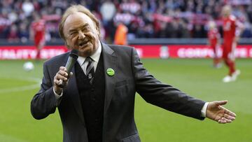 Liverpool supporter and singer Gerry Marsden sings You'll Never Walk Alone before their English Premier League soccer match against Blackburn Rovers at Anfield in Liverpool, northern England, October 24, 2010. REUTERS/Phil Noble (BRITAIN - Tags: