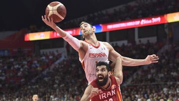 GUANGZHOU, CHINA - SEPTEMBER 04: Victor Claver #10 of Spain and Mohammad Jamshidijafarabadi #13 of Iran fight for the ball during FIBA World Cup 2019 Group C match between Spain and Iran at Guangzhou Gymnasium on September 4, 2019 in Guangzhou, Guangdong 