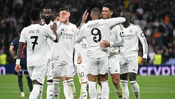 Real Madrid's French forward #09 Kylian Mbappe (C) celebrates with teammates after scoring their third goal during the UEFA Champions League, league phase football match between Real Madrid CF and FC Salzburg at the Santiago Bernabeu stadium in Madrid on January 22, 2025. (Photo by JAVIER SORIANO / AFP)