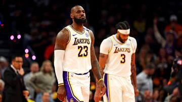 Nov 26, 2024; Phoenix, Arizona, USA; Los Angeles Lakers forward LeBron James (23) and forward Anthony Davis (3) walk off the court during the second quarter against the Phoenix Suns at Footprint Center. Mandatory Credit: Mark J. Rebilas-Imagn Images