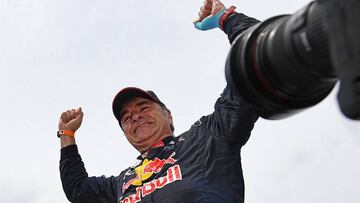 Peugeot&#039;s Spanish driver Carlos Sainz celebrates after winning the Dakar Rally 2018, at the end of the last stage in and around Cordoba province in Argentina on January 20, 2018. 
 Spanish veteran Carlos Sainz clinched overall victory in the 2018 Dak