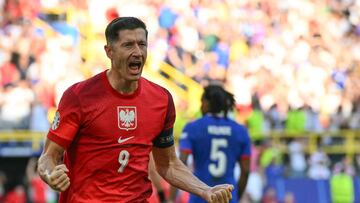 Poland's forward #09 Robert Lewandowski celebrates scoring his team's first goal during the UEFA Euro 2024 Group D football match between France and Poland at the BVB Stadion in Dortmund on June 25, 2024. (Photo by Alberto PIZZOLI / AFP)