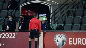 Soccer Football - World Cup - UEFA Qualifiers - Group F - Moldova v Scotland - Zimbru Stadium, Chisinau, Moldova - November 12, 2021 Referee Srdjan Jovanovic reviews a play on the VAR screen REUTERS/Gleb Garanich