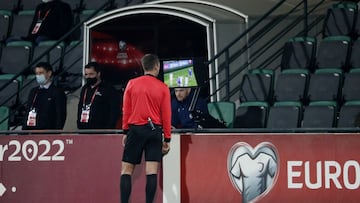 Soccer Football - World Cup - UEFA Qualifiers - Group F - Moldova v Scotland - Zimbru Stadium, Chisinau, Moldova - November 12, 2021 Referee Srdjan Jovanovic reviews a play on the VAR screen REUTERS/Gleb Garanich