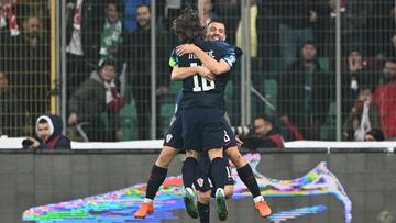 Croatia's midfielder Mateo Kovacic (C,R) celebrates with Croatia's midfielder Luka Modric after scoring a goal during the UEFA Euro 2024 qualifier football match between Turkey and Croatia at Bursa Metropolitan Stadium, on March 28, 2023. (Photo by OZAN KOSE / AFP)