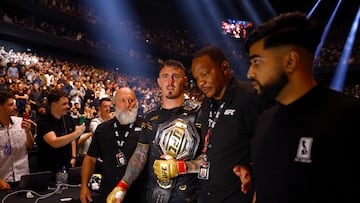 Mixed Martial Arts - UFC 304 - Manchester - Co-op Live, Manchester, Britain - July 28, 2024. Tom Aspinall walks after winning his fight against Curtis Blaydes. REUTERS/John Sibley