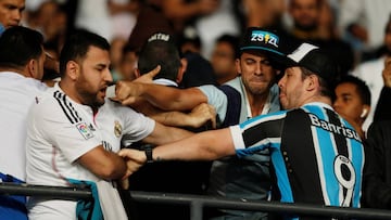 Soccer Football - FIFA Club World Cup Final - Real Madrid vs Gremio FBPA - Zayed Sports City Stadium, Abu Dhabi, United Arab Emirates - December 16, 2017   Real Madrid and Gremio fans fight before the match    REUTERS/Matthew Childs