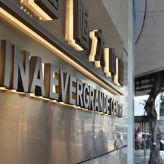 How does Evergrande conglomerate put China's housing system in danger of collapse?