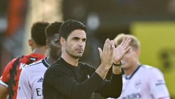 Arsenal's Spanish manager Mikel Arteta (front) applauds as he celebrates with teammates after winning at the end of the English Premier League football match between Bournemouth and Arsenal at the Vitality Stadium in Bournemouth, southern England on August 20, 2022. - Arsenal won 3 - 0 against Bournemouth. - RESTRICTED TO EDITORIAL USE. No use with unauthorized audio, video, data, fixture lists, club/league logos or 'live' services. Online in-match use limited to 120 images. An additional 40 images may be used in extra time. No video emulation. Social media in-match use limited to 120 images. An additional 40 images may be used in extra time. No use in betting publications, games or single club/league/player publications. (Photo by Glyn KIRK / AFP) / RESTRICTED TO EDITORIAL USE. No use with unauthorized audio, video, data, fixture lists, club/league logos or 'live' services. Online in-match use limited to 120 images. An additional 40 images may be used in extra time. No video emulation. Social media in-match use limited to 120 images. An additional 40 images may be used in extra time. No use in betting publications, games or single club/league/player publications. / RESTRICTED TO EDITORIAL USE. No use with unauthorized audio, video, data, fixture lists, club/league logos or 'live' services. Online in-match use limited to 120 images. An additional 40 images may be used in extra time. No video emulation. Social media in-match use limited to 120 images. An additional 40 images may be used in extra time. No use in betting publications, games or single club/league/player publications. (Photo by GLYN KIRK/AFP via Getty Images)