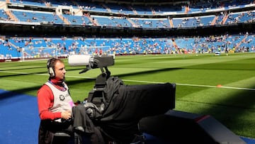 A tv cameraman operates a camera prior to   the La Liga match between Real Madrid and Eibar at Estadio Santiago Bernabeu on April 11, 2015 in Madrid, Spain. 