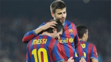 Messi y Piqué.