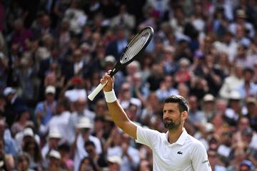 Serbia's Novak Djokovic celebrates winning against Britain's Jacob Feamley during their men's singles tennis match on the fourth day of the 2024 Wimbledon Championships at The All England Lawn Tennis and Croquet Club in Wimbledon, southwest London, on July 4, 2024. (Photo by Ben Stansall / AFP) / RESTRICTED TO EDITORIAL USE