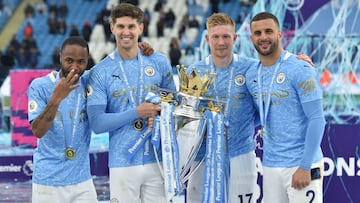 Soccer Football - Premier League - Manchester City v Everton - Etihad Stadium, Manchester, Britain - May 23, 2021 Manchester City&#039;s Raheem Sterling, John Stones, Kevin De Bruyne and Kyle Walker pose with the trophy as they celebrate after winning the