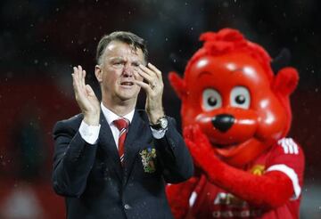 Louis van Gaal applauds fans during a lap of honour 