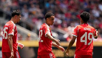 CINCINNATI, OHIO - JUNE 15: Jamal Musiala #42 of FC Bayern Munchen celebrates scoring his team's ninth goal with Adam Aznou #49 and Aleksandar Pavlovic #45 during the FIFA Club World Cup 2025 group C match between FC Bayern M�nchen and Auckland City FC at TQL Stadium on June 15, 2025 in Cincinnati, Ohio. Dylan Buell/Getty Images/AFP (Photo by Dylan Buell / GETTY IMAGES NORTH AMERICA / Getty Images via AFP)