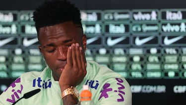 Brazil's forward Vinicius Junior cries as he gives a press conference on the eve of the international friendly football match between Spain and Brazil at the Ciudad Real Madrid training ground in Valdebebas, outskirts of Madrid, on March 25, 2024. Spain arranged a friendly against Brazil at the Santiago Bernabeu under the slogan "One Skin" to help combat racism. (Photo by Pierre-Philippe MARCOU / AFP)