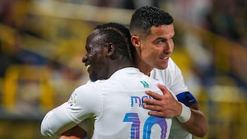 Nassr's Portuguese forward #07 Cristiano Ronaldo (R) celebrates his goal with Nassr's Senegalese Forward #10 Sadio Mane during the Saudi Pro League football match between Al-Nassr and Al-Riyadh at al-Awwal Park Stadium in Riyadh on December 8, 2023. (Photo by Fayez NURELDINE / AFP)