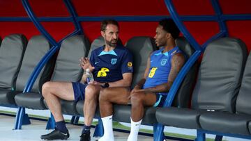 DOHA, QATAR - NOVEMBER 27: Gareth Southgate, Head Coach of England, talks to Raheem Sterling of England during a training session at Al Wakrah Stadium on November 27, 2022 in Doha, Qatar. (Photo by Eddie Keogh - The FA/The FA via Getty Images)
