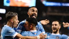 Oct 17, 2022; Queens, New York, USA;  New York City FC midfielder Maximiliano Moralez, top, celebrates his goal in the 69th minute with teammates Santiago Rodriguez, bottom, and New York City FC midfielder Gabriel Pereira, left, during the second half of a MLS Eastern Conference quarterfinal match against Inter Miami CF at Citi Field. Mandatory Credit: Mark Smith-USA TODAY Sports