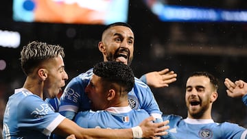 Oct 17, 2022; Queens, New York, USA; New York City FC midfielder Maximiliano Moralez, top, celebrates his goal in the 69th minute with teammates Santiago Rodriguez, bottom, and New York City FC midfielder Gabriel Pereira, left, during the second half of a MLS Eastern Conference quarterfinal match against Inter Miami CF at Citi Field. Mandatory Credit: Mark Smith-USA TODAY Sports