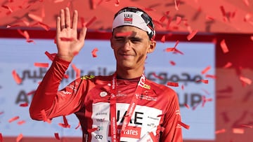 UAE Team Emirates's Mexican rider Isaac Del Toro Romero celebrates on the podium after winning the red jersey in the sixth stage of the UAE Tour cycling event from al-Ain Museum to Jebel Hafeet in Abu Dhabi on February 21, 2026. (Photo by Fadel SENNA / AFP)