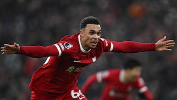 Liverpool's English defender #66 Trent Alexander-Arnold celebrates after scoring their fourth goal during the English Premier League football match between Liverpool and Fulham at Anfield in Liverpool, northwest England, on December 3, 2023. (Photo by Paul ELLIS / AFP) / RESTRICTED TO EDITORIAL USE. No use with unauthorized audio, video, data, fixture lists, club/league logos or 'live' services. Online in-match use limited to 120 images. An additional 40 images may be used in extra time. No video emulation. Social media in-match use limited to 120 images. An additional 40 images may be used in extra time. No use in betting publications, games or single club/league/player publications. / 