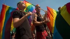 (FILES) In this file photo taken on August 17, 2013 Men wearing rainbow flags take part in the third gay pride festival in the Czech capital Prague. 
 The Czech government on June 22, 2018 backed draft legislation that would make the country the first pos