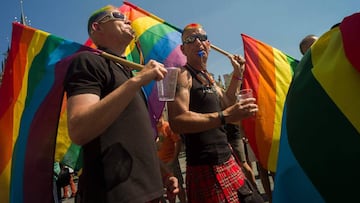 (FILES) In this file photo taken on August 17, 2013 Men wearing rainbow flags take part in the third gay pride festival in the Czech capital Prague. 
 The Czech government on June 22, 2018 backed draft legislation that would make the country the first pos