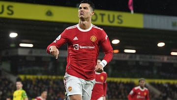 Manchester United&#039;s Portuguese striker Cristiano Ronaldo celebrates after scoring the opening goal from the penalty spot during the English Premier League football match between Norwich City and Manchester United at Carrow Road Stadium in Norwich, ea