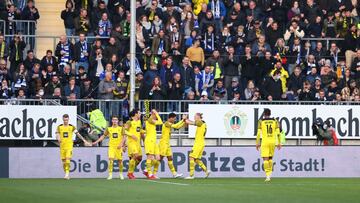 BIELEFELD, GERMANY - OCTOBER 23: Jude Bellingham celebrates with teammates Erling Haaland, Marco Reus and Mats Hummels of Borussia Dortmund after scoring their team&#039;s third goal during the Bundesliga match between DSC Arminia Bielefeld and Borussia D