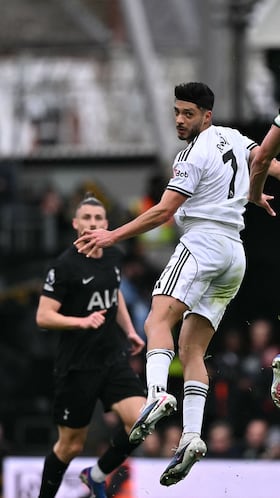Fulham's Mexican striker #07 Raul Jimenez (C) vies with Tottenham Hotspur's Dutch defender #37 Micky van de Ven (R) during the English Premier League football match between Fulham and Tottenham Hotspur at Craven Cottage in London on March 1, 2026. (Photo by Ben STANSALL / AFP) / RESTRICTED TO EDITORIAL USE. No use with unauthorized audio, video, data, fixture lists, club/league logos or 'live' services. Online in-match use limited to 120 images. An additional 40 images may be used in extra time. No video emulation. Social media in-match use limited to 120 images. An additional 40 images may be used in extra time. No use in betting publications, games or single club/league/player publications. /
