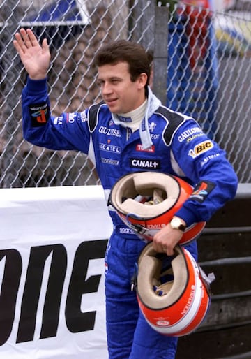 MON09D:SPORT-MOTOR RACING:MONACO,13MAY99 - French formula one driver Olivier Panis waves at the crowd on his way to the pits in the first day of trials for the Monaco Grand Prix 13 May. Panis set the third best time. The Grand Prix will be run on May 16th