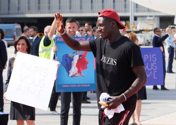 Soccer Football - World Cup - The France team return from the World Cup in Russia - Charles de Gaulle Airport, Paris, France - July 16, 2018 France's Benjamin Mendy gestures as he arrives