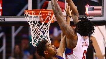 Mar 30, 2017; Phoenix, AZ, USA; Los Angeles Clippers center DeAndre Jordan (right) dunks the ball against Phoenix Suns forward Marquese Chriss in the first half at Talking Stick Resort Arena. Mandatory Credit: Mark J. Rebilas-USA TODAY Sports