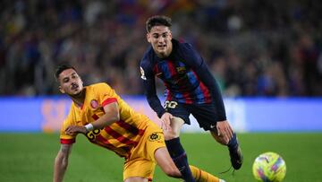 BARCELONA, SPAIN - APRIL 10: Gavi of FC Barcelona competes for the ball with Javi Hernandez of Girona FC during the LaLiga Santander match between FC Barcelona and Girona FC at Spotify Camp Nou on April 10, 2023 in Barcelona, Spain. (Photo by Alex Caparros/Getty Images)