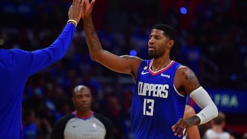 Oct 23, 2022; Los Angeles, California, USA; Los Angeles Clippers guard Paul George (13) is greeted during a time out against the Phoenix Suns in the second half at Crypto.com Arena. Mandatory Credit: Gary A. Vasquez-USA TODAY Sports