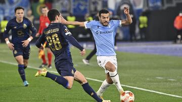 Lazio's Pedro, right, and Porto's Bruno Costa vie for the ball during the Europa League soccer match between Lazio and Porto at the Rome Olympic stadium, Thursday, Feb. 24, 2022. (Fabrizio Corradetti/LaPresse via AP)