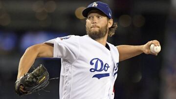 FILE - In this Oct. 5, 2018, file photo, Los Angeles Dodgers starting pitcher Clayton Kershaw throws to an Atlanta Braves batter during the first inning of Game 2 of a National League Division Series baseball game in Los Angeles. The Dodgers and three-time Cy Young Award winner Kershaw reached an agreement on a contract extension Friday, Nov. 2, 2018, that will keep the seven-time All-Star with the club through 2021. (AP Photo/Mark J. Terrill, File)