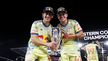 Nov 30, 2024; Orlando, Florida, USA; New York Red Bulls midfielder Daniel Edelman (75) and defender John Tolkin (47) celebrate after winning in the 2024 MLS Cup Eastern Conference Final match at Inter&Co Stadium. Mandatory Credit: Morgan Tencza-Imagn Images